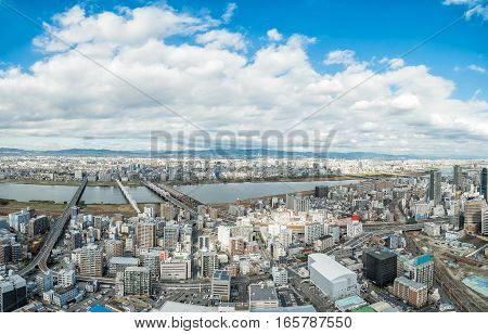 Osaka urban city and Yodo river from rooftop view. Japan.