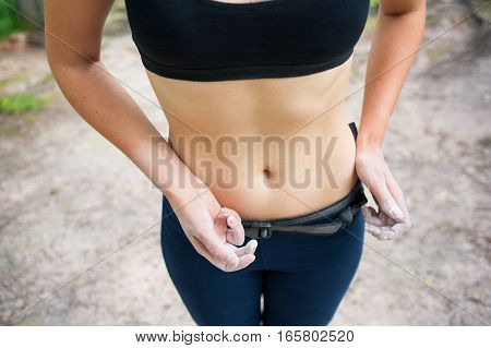 Woman With Nice Waist Hands With Magnesium Preparing Climbing