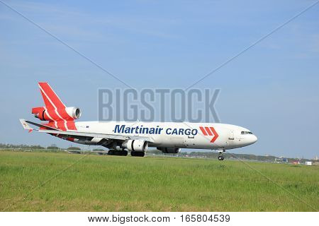May11th 2015 Schiphol Airport the Netherlands: PH-MCU Martinair Holland McDonnell Douglas MD-11 on Polderbaan runway. Martin Air is based in Amsterdam and was founded in 1958 Since 2014 Martinair operates primarily as a cargo airline.