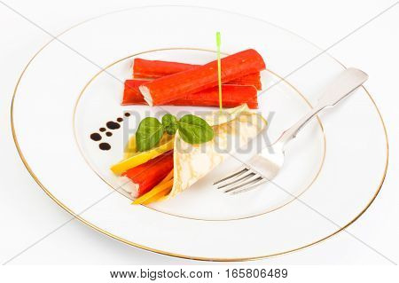 Pancake roll with crab sticks. Studio Photo