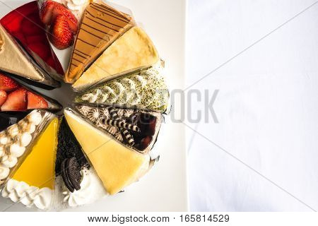 Topdown view of cakes strawberry cheese chocolate blue berry coffee cakes taken outdoor with natural lights