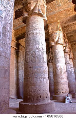 DENDERA, EGYPT - NOVEMBER 2, 2011: The huge pillars and beautiful ceiling inside Dendera temple dedicated to Hathor goddess