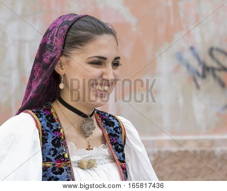 CAGLIARI, ITALY - May 1, 2014: 358 Religious Procession of Sant'Efisio - Sardinia - portrait of a beautiful smiling girl in traditional Sardinian costume