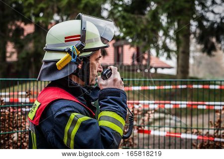 HDR - Firefighter in action with a walkie talkie