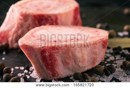 Two Slices Of Marrowbone On Black Board