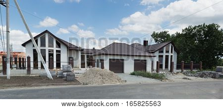Unfinished beautiful cottage for two families with garages for car