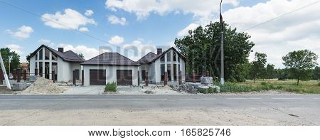 The construction of the cottage and landscaping
