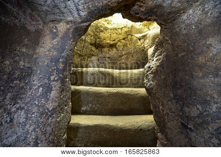 arch carved in rock, entrance to an underground pre-columbian burial chamber in Tierradentro Colombia