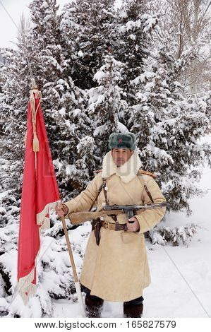 Officer the defender of Stalingrad in winter regimentals with the Red banner