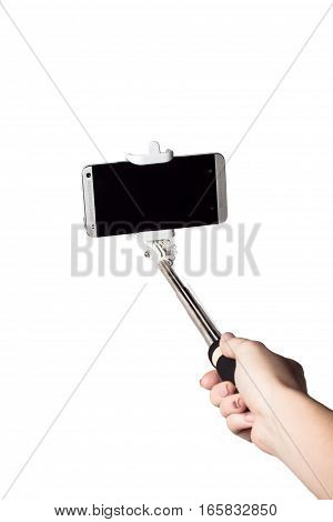 Woman hand hold monopod with mobile phone isolated white clipping path inside