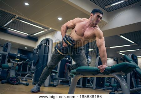 At the sports Hall. Man training. Sports. Hard Work Gym