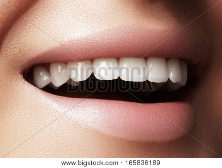 Beautiful smile with whitening teeth. Dental photo. Macro closeup of perfect female mouth lipscare rutine.