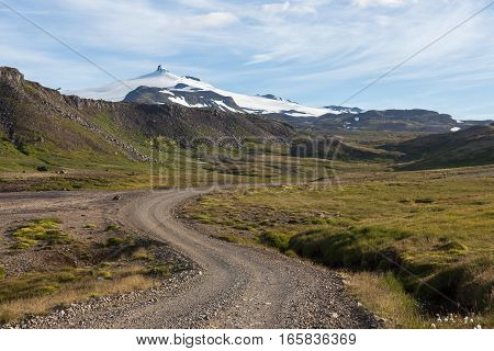 Iceland Rural Road In Beautiful Icelandic Mountain Landscape With White Glacier Cap Of Snaefellsjoku