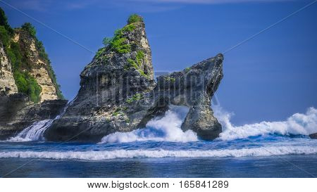 Huge Wave hitting the Rock in the ocean at Atuh beach on Nusa Penida island, Indonesia.