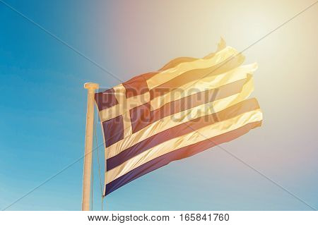 Old flag of the Greece in the wind