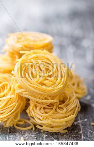 raw pasta noodles cooking on a table