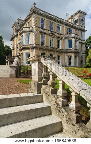 EXETER DEVON UK - July 11 2016: University of Exeter. Reed Hall. Many of green trees. Summer. Day.