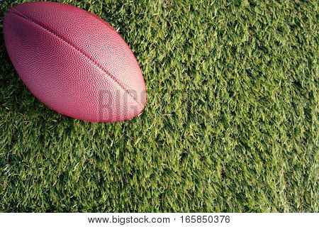 Vintage football over grass seen from above