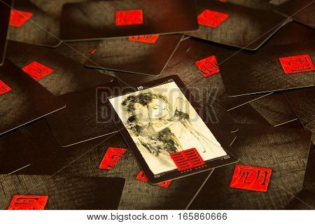 Moscow, Russia - December 4, 2016: Chinese tarot cards with traditional chinese art and hexagrams. Esoteric background