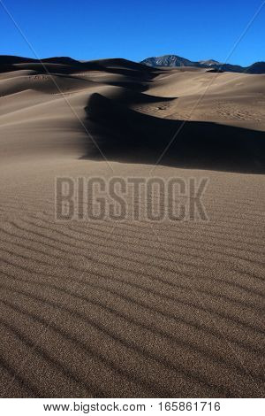 Ripples of sand and shadows at the Great Sand Dunes National Park near Alamosa, Colorado in spring