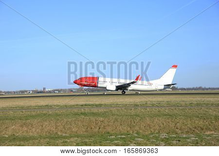 March 22nd 2015 Amsterdam Schiphol Airport LN-NGO Norwegian Air Shuttle Boeing 737-800 take off from Polderbaan Runway