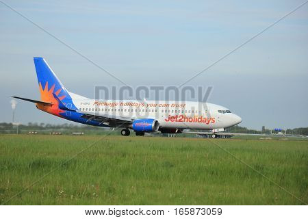 May11th 2015 Amsterdam the Netherlands: G-GDFO Jet2 Boeing 737-300 on the Polderbaan runway of Amsterdam Schiphol Airport. Jet2.com Limited is a British low-cost airline in the United Kingdom. Jet2.com uses the brand Jet2charters to distinguish their char
