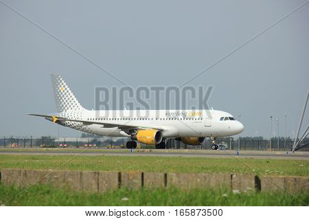 Amsterdam The Netherlands - August 10 2015: EC-KDX Vueling Airbus A320-200 taxing on the Polderbaan runway to the main terminal of Amsterdam Schiphol Airport