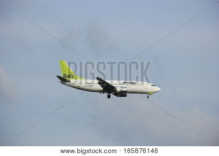 Amsterdam Schiphol Airport - April 1st 2016: YL-BBS Air Baltic Boeing 737-31S approaching Polderbaan runway arriving from Riga Latvia