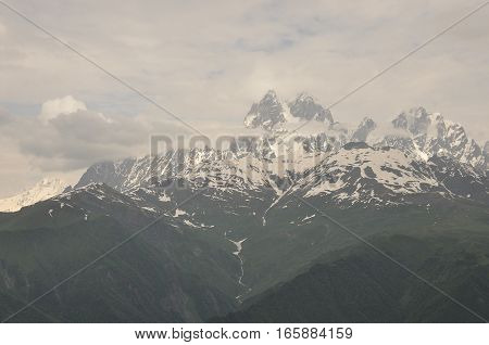 Ushba peak in the Caucasus Mountains. Snowy playing.