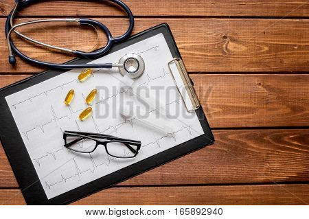 doctor workplace at wooden table with microscope in lab top view no one