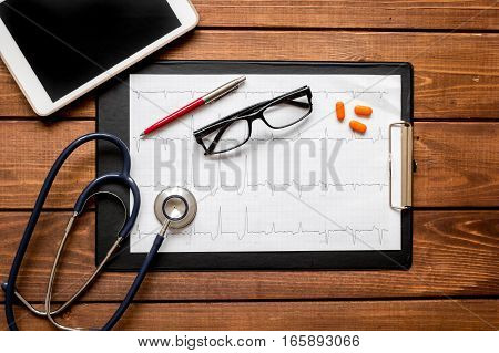 doctor workplace at wooden table with microscope in lab top view no one
