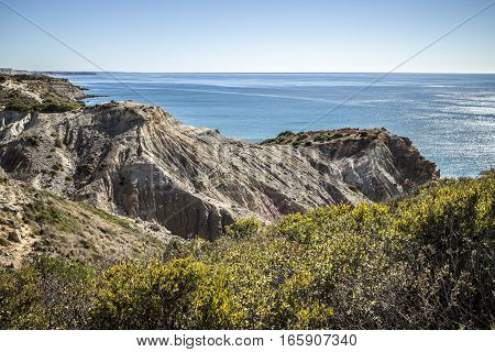 Walking along the coastline in Algarve, Portugal