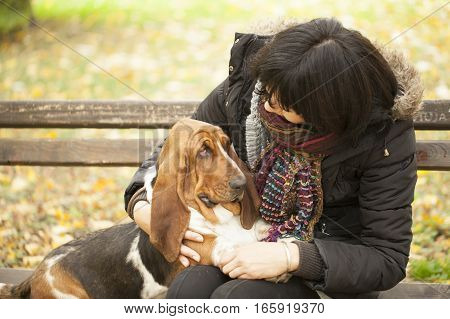 The woman with a dog in the park Selective focus and small depth of field lens flare