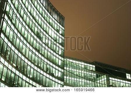 BERLIN, GERMANY - 30 JANUARY 2005: Night view detail of a curved modern business skyscraper.