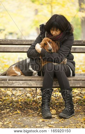 The woman with a dog in the park Selective focus and small depth of field lens flare