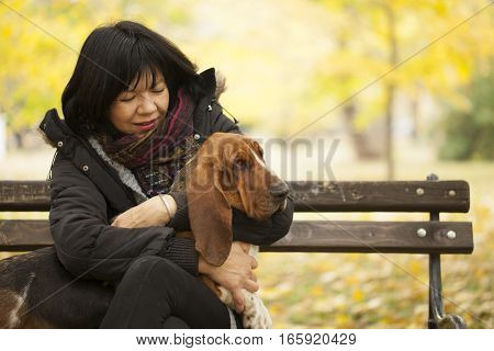 The woman with a dog in the park Selective focus and small depth of field lens flare