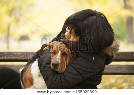 The woman with a dog in the park Selective focus and small depth of field lens flare