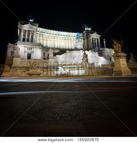 A low-angle night view of the popular Rome landmark The Monumento Nazionale a Vittorio Emanuele II (The Altare della Patria).