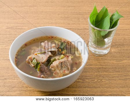 Thai Cuisine and Food A Bowl of Thai Clear Spicy Hot and Sour Soup with Beef Entrails.