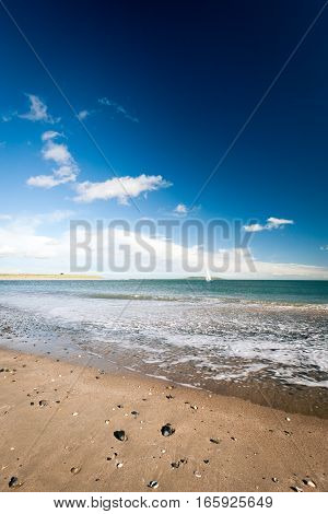 The beach near Malahide Ireland with a wide angle view out over the Irish Sea.