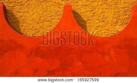 Abstract background colored in yellow and red color of concrete.