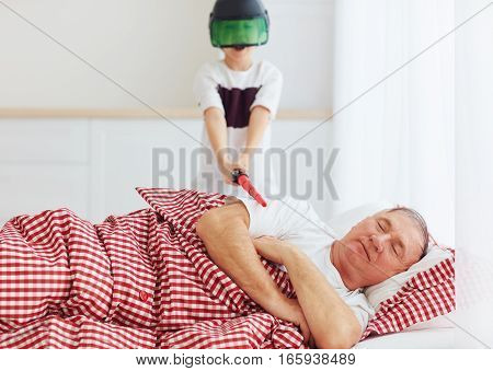 Naughty Yelling Grandson Waking Grandpa Up By Playing Around In Loud, Noisy Games