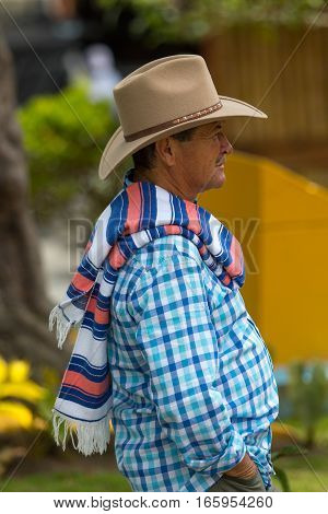 September 23, 2016 Filandia, Colombia: a local farmer dressed in a traditional way, wearing sombrero and folded poncho over the shoulder