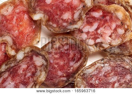 Fouette sausage sliced close up isolate on a white