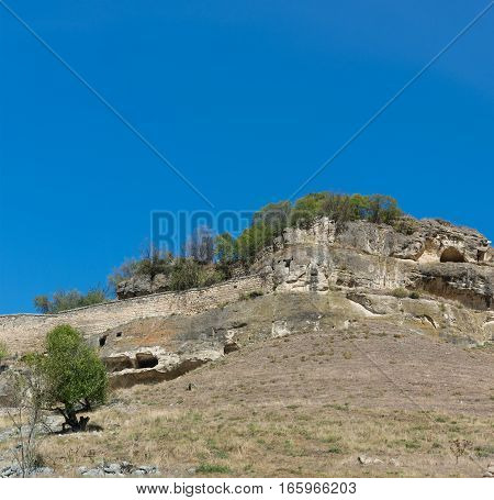 Medieval cave city-fortress Chufut-Kale and blue sky,  Crimea