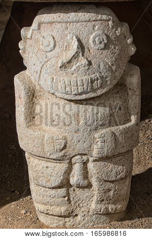 closeup details of a pre-columbian stone statue in the San Agustin archaeological park in Colombia