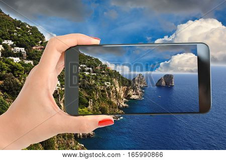 Tourist taking a picture of an amazing landscape on Amalfi Coast, Italy