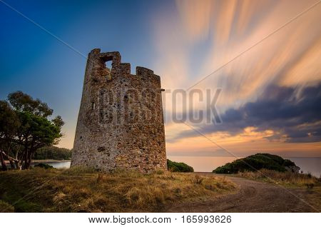 Saracen tower Torre di Cala on Sardegna near Cagliari at sunset Italy