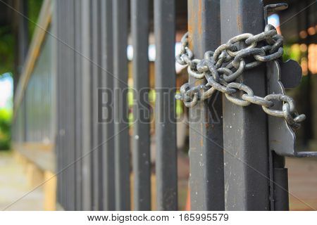 Grille doors were closed and padlocked with chains.