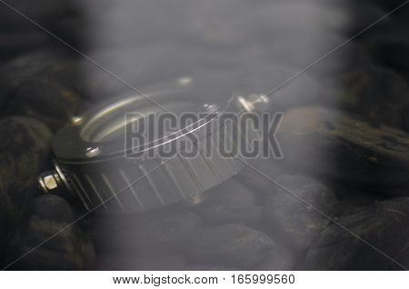 Underwater lighting with water reflection. Artistic image